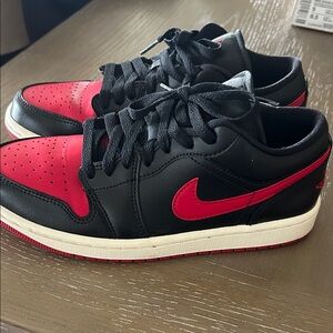 Nike  Women’s AirJordan 1 low Black and Red Sneakers